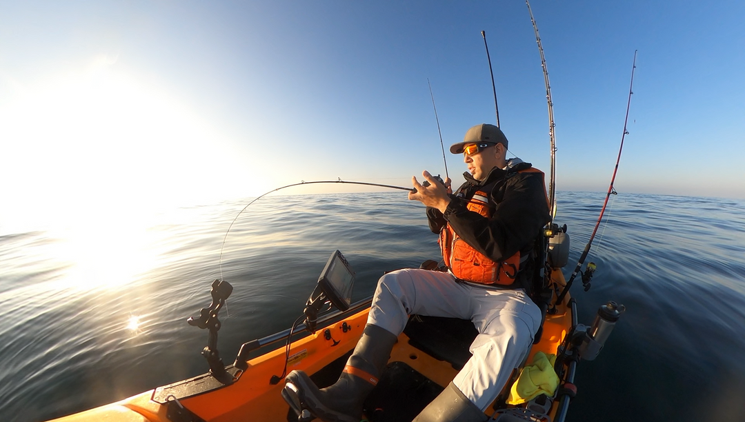 fisherman on kayak with bent rod
