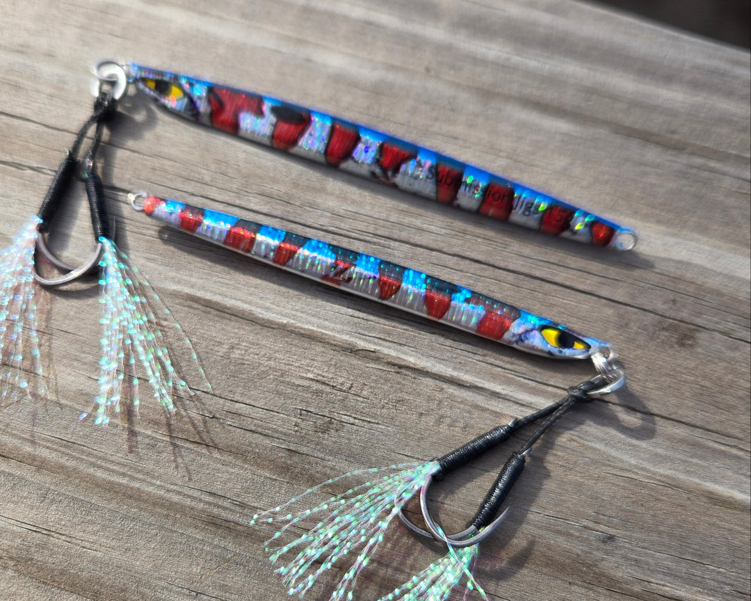 Two fishing lures with colorful patterns on a wooden surface
