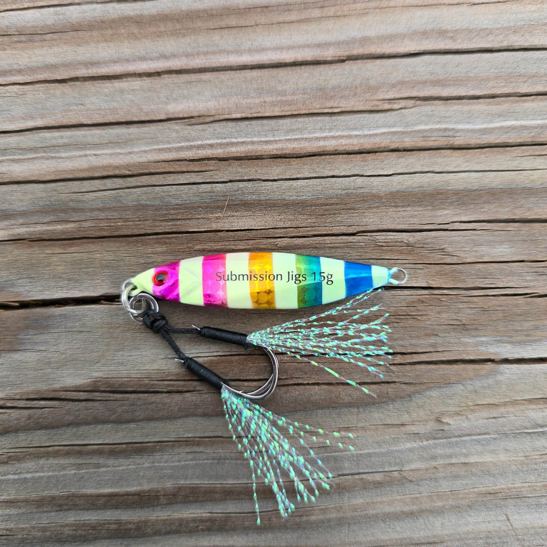 Submission Fishing Micro Mercenary 15g slow pitch jig in Rainbow Roll color with saltwater-grade BKK assist hooks and UV flash tassels.