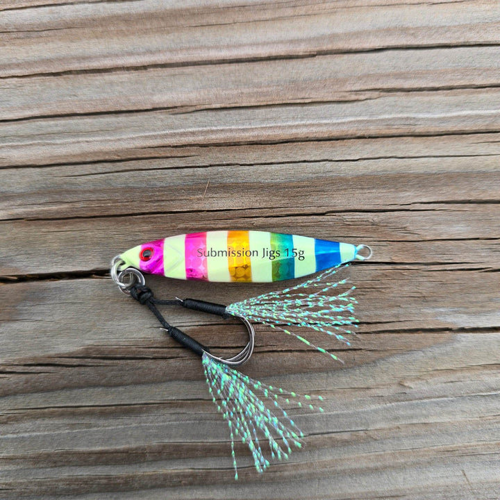 Submission Fishing Micro Mercenary 15g slow pitch jig in Rainbow Roll color with saltwater-grade BKK assist hooks and UV flash tassels.