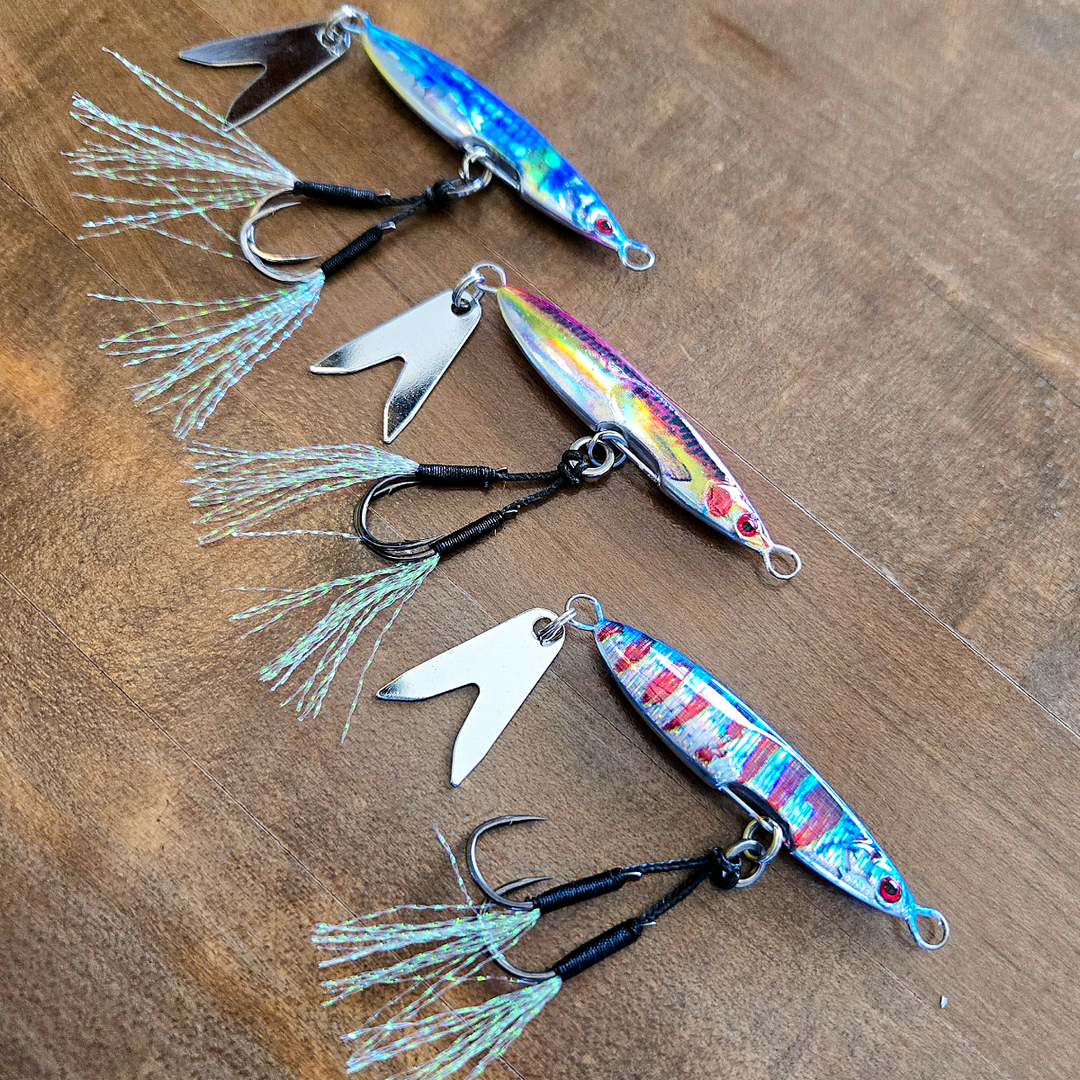 Death Blade 3-pack slow pitch fishing jigs featuring three color options with assist hooks and flashing fish tail blades