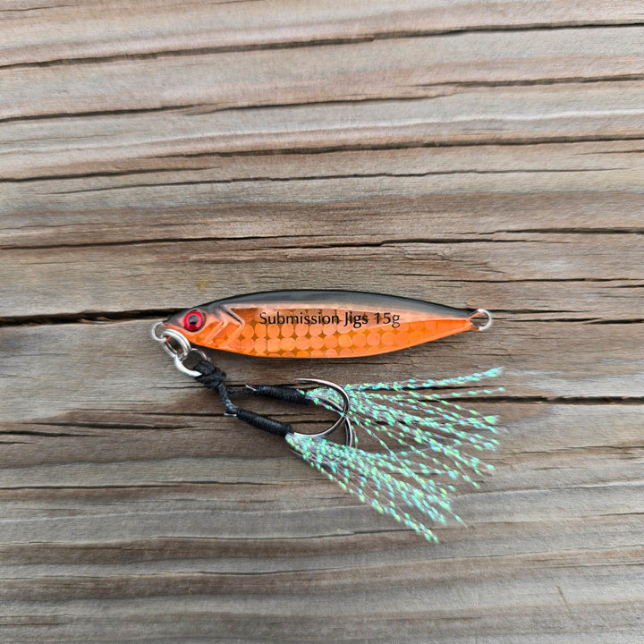 Submission Fishing Micro Mercenary 15g slow pitch jig in Orange Pumpkin color with saltwater-grade BKK assist hooks and UV flash tassels.